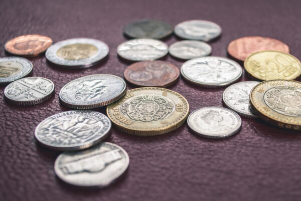 Multiple currency coins on table