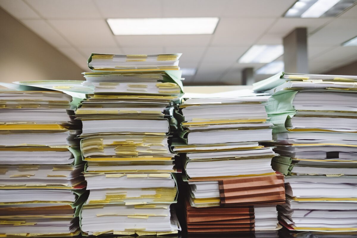 Pile of physical documents instead of cloud storage