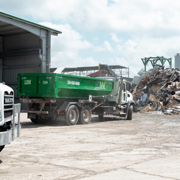 Photo of a Southwest Waste Services dumpster truck